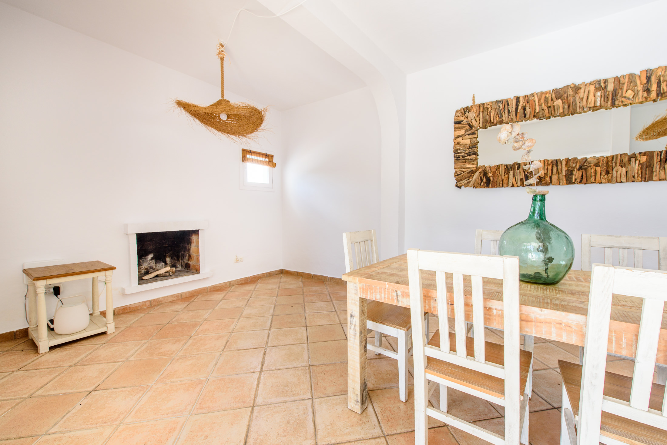 resa estates ibiza for sale house  ses salines 2022 finca dining and fireplace.jpg